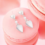 Pendientes largos de plata de ley con corazón rosa "Pink Moment" de FANCIME con perla blanca y piedras CZ