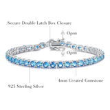 Pulsera de tenis de topacio azul de plata de ley "Joyful Delight"