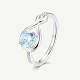 Anillo de Promesa "Abrazo Infinito" con Aguamarina