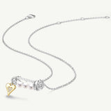Collar de plata con perla y alfiler de rosa
