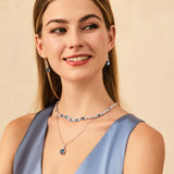 "Glamour Radiance" Collar de tenis de plata de ley con topacio azul tallado elegante, piedra de nacimiento de diciembre