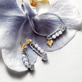 Pendientes de plata con perla y alfiler de rosa