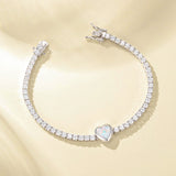 Pulsera de tenis de plata de ley con ópalo de nacimiento de octubre en corte corazón "Axis" de FANCIME