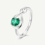 Anillo de Promesa "Abrazo Infinito" con Esmeralda