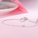 "Abrazo Infinito" Pulsera de plata de ley con símbolo de infinito y piedra de piedra lunar, piedra de nacimiento de junio