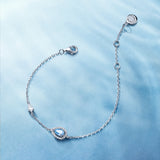 Pulsera de plata con piedra de nacimiento Ojo del océano en aguamarina