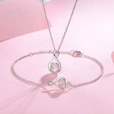 "Abrazo Infinito" Pulsera de plata de ley con símbolo de infinito y piedra de piedra lunar, piedra de nacimiento de junio