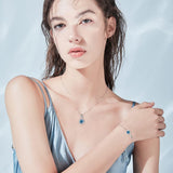 "Abrazo Infinito" Pulsera de plata de ley con símbolo de infinito y piedra de topacio de Londres, piedra de nacimiento de diciembre
