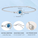 "Abrazo Infinito" Pulsera de plata de ley con símbolo de infinito y piedra de topacio de Londres, piedra de nacimiento de diciembre