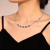 "Glamour Radiance" Collar de tenis de plata de ley con topacio azul tallado elegante, piedra de nacimiento de diciembre