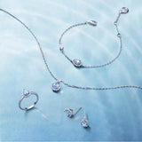 Collar de plata con gota y piedra de nacimiento Ojo del océano en aguamarina