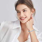 Pulsera de tenis de topacio azul de plata de ley "Joyful Delight"