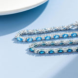 Pulsera de plata de ley con topacio azul talla fancy corte tenis "Glamour Radiance" piedra de nacimiento de diciembre