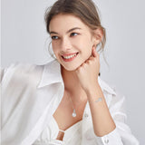 "Abrazo Infinito" Collar con colgante de símbolo de infinito en plata de ley con perla blanca, piedra de nacimiento de junio - Plata