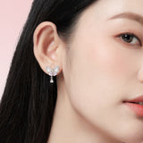 Pendientes de plata de ley con lazo mariposa “Pearl Kiss” de FANCIME