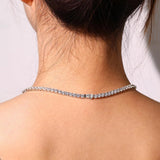 "Glamour Radiance" Collar de tenis de plata de ley con topacio azul tallado elegante, piedra de nacimiento de diciembre