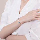 Pulsera de tenis de plata de ley FANCIME Halo Corazón con piedra de nacimiento de marzo de aguamarina