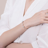 Pulsera de tenis de plata de ley FANCIME Halo Corazón con piedra de nacimiento de abril de circonita cúbica