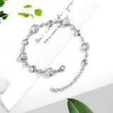 Pulsera de tenis de plata de ley FANCIME Halo Corazón con piedra de nacimiento de junio de piedra lunar