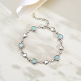 Pulsera de tenis de plata de ley FANCIME Halo Corazón con piedra de nacimiento de octubre de ópalo