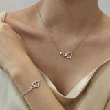 Collar de oro macizo de 14K con corazón infinito entrelazado de FANCIME